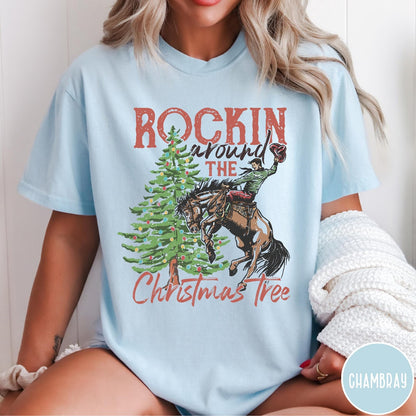 Comfort Colors tee in Chambray featuring western graphic design of a cowboy on a bucking horse Christmas tree