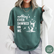 Comfort Colors tee in Light Green featuring illustrated style graphic of a small bear looking up at stars