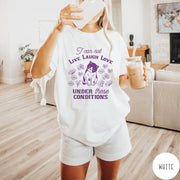 Comfort Colors tee in White featuring whimsical graphic style with a cat and flowers and text.