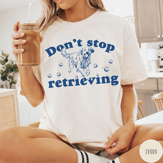 Comfort Colors tee in Ivory featuring screen print style graphic of a Golden Retriever with tennis balls