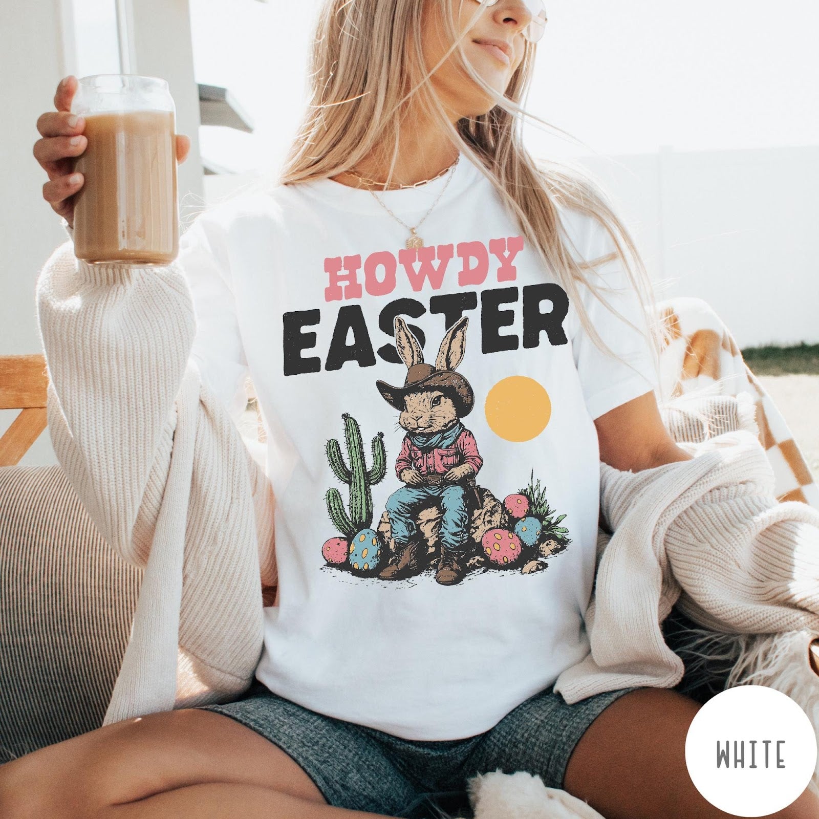 Comfort Colors tee in White featuring western design style cowboy bunny sitting on a rock with cactus