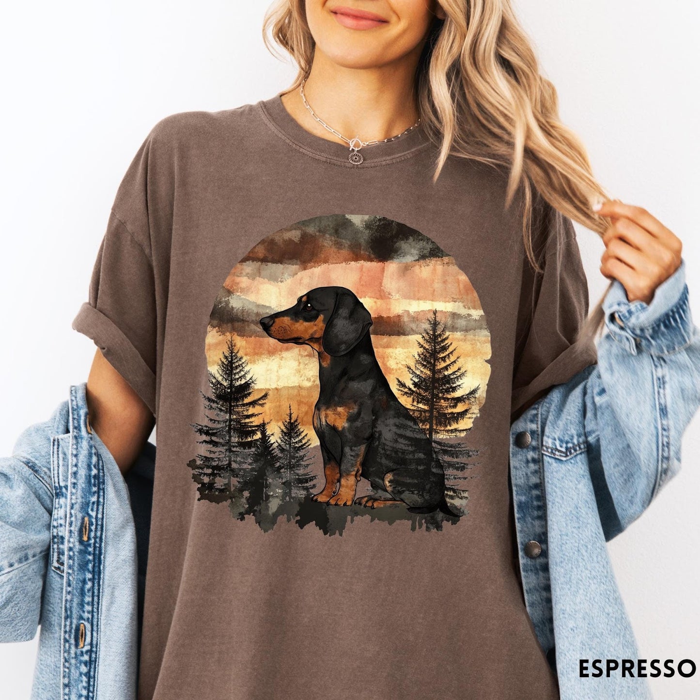 Comfort Colors tee in Espresso featuring vintage style dachshund dog graphic with forest and sunset background
