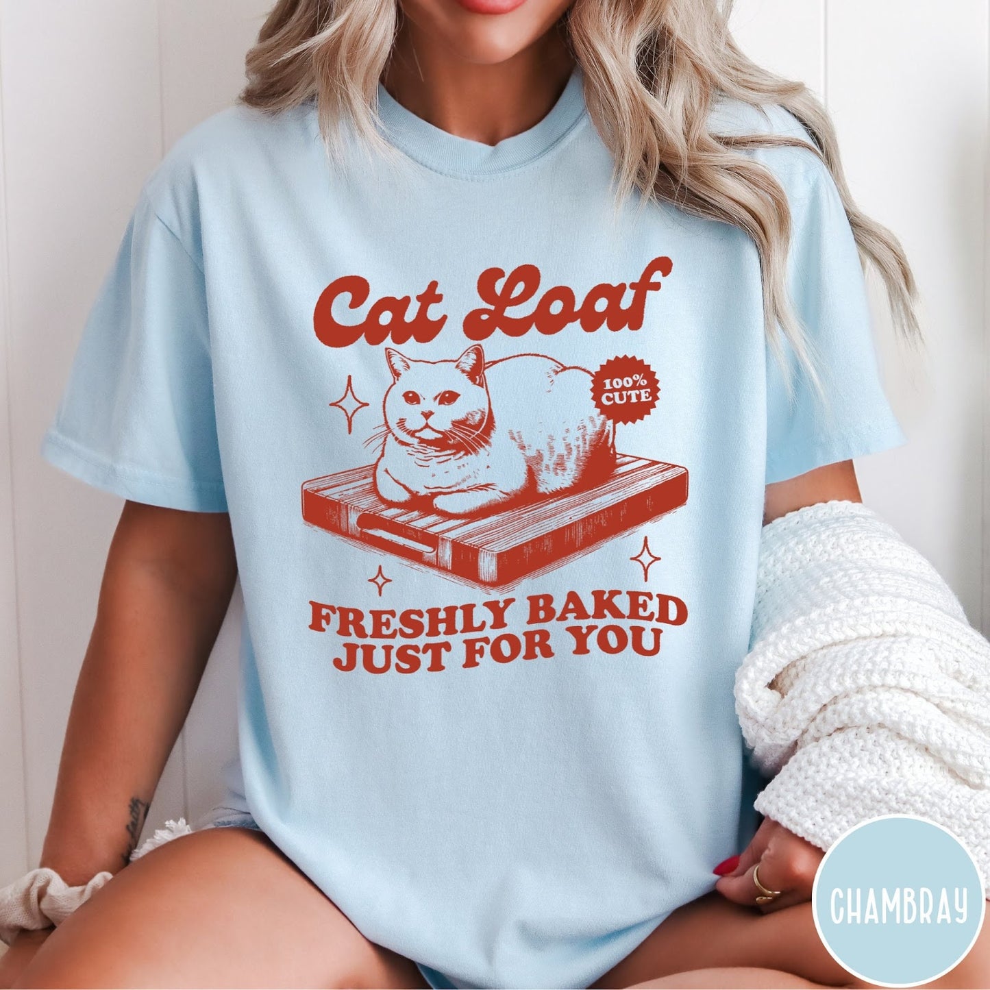 Comfort Colors tee in Chambray featuring graphic style cat loaf sitting on a wooden cutting board