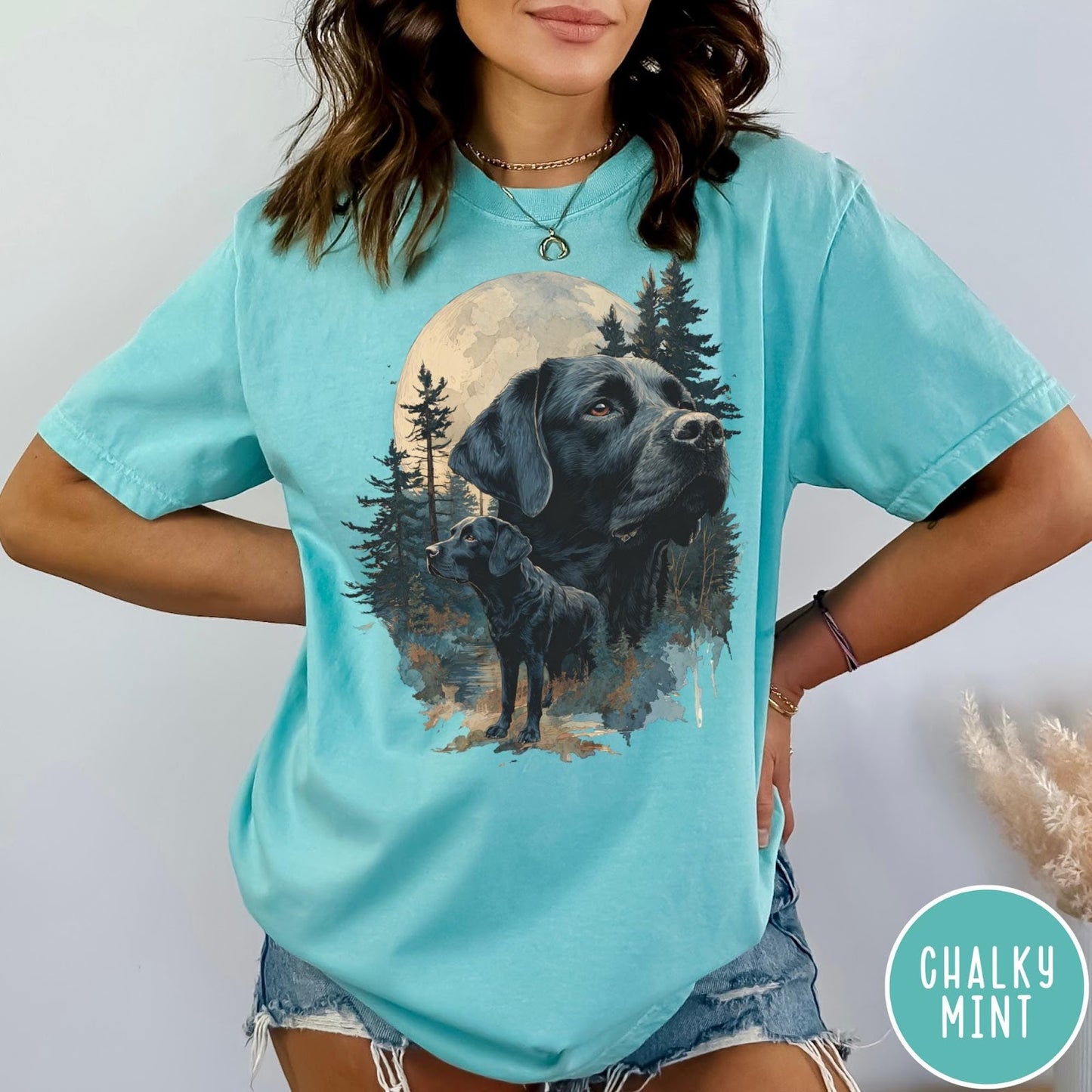 Comfort Colors tee in Chalky Mint featuring artistic graphic of Black Labrador dogs in a forest moon setting