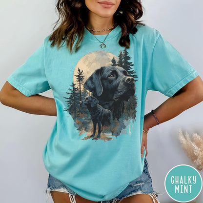 Comfort Colors tee in Chalky Mint featuring artistic graphic of Black Labrador dogs in a forest moon setting