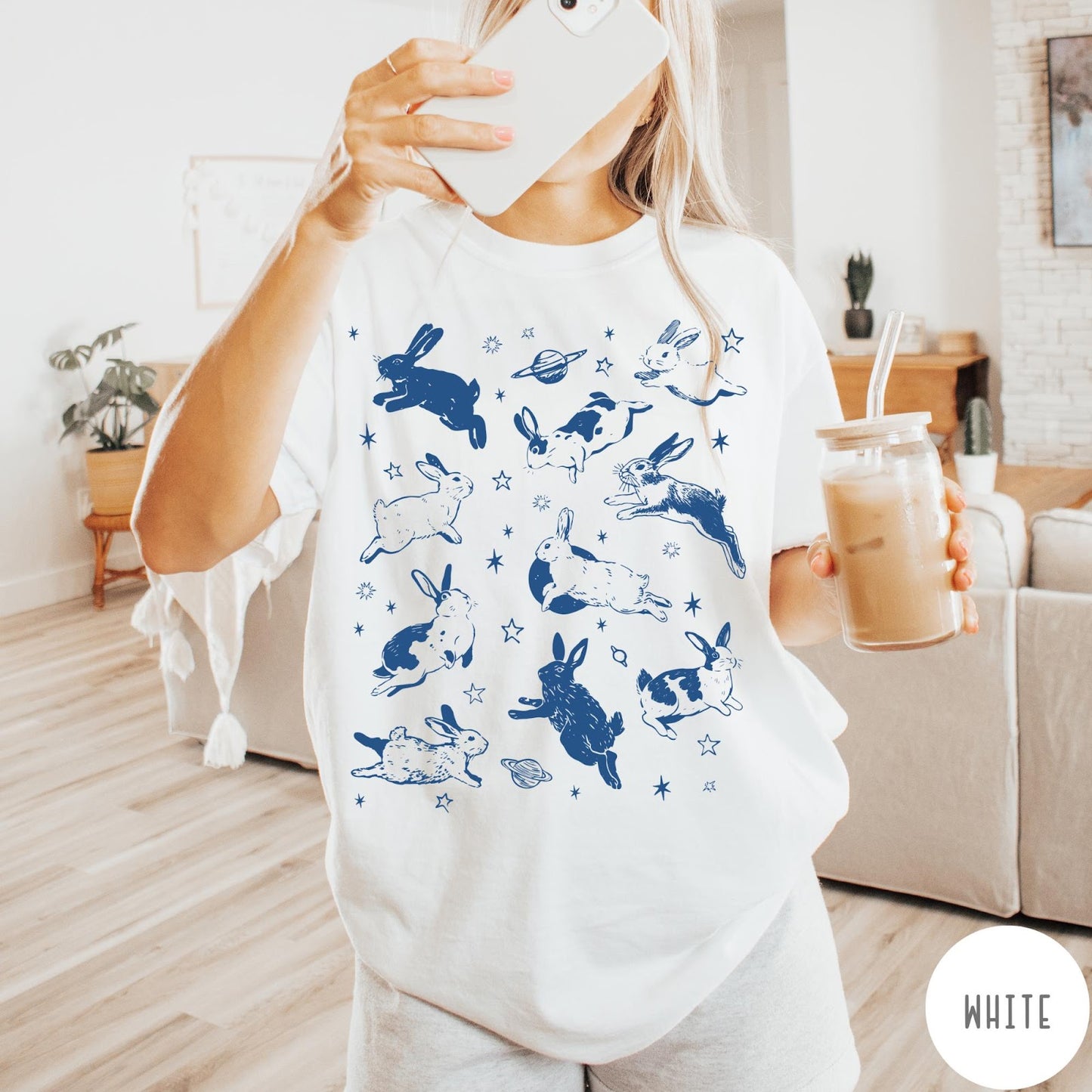 Comfort Colors tee in White featuring celestial design style with jumping bunnies and planets graphic print
