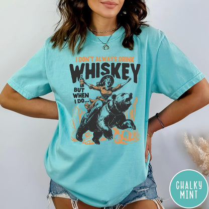 Comfort Colors tee in Chalky Mint featuring vintage style graphic of a woman riding a bear holding whiskey
