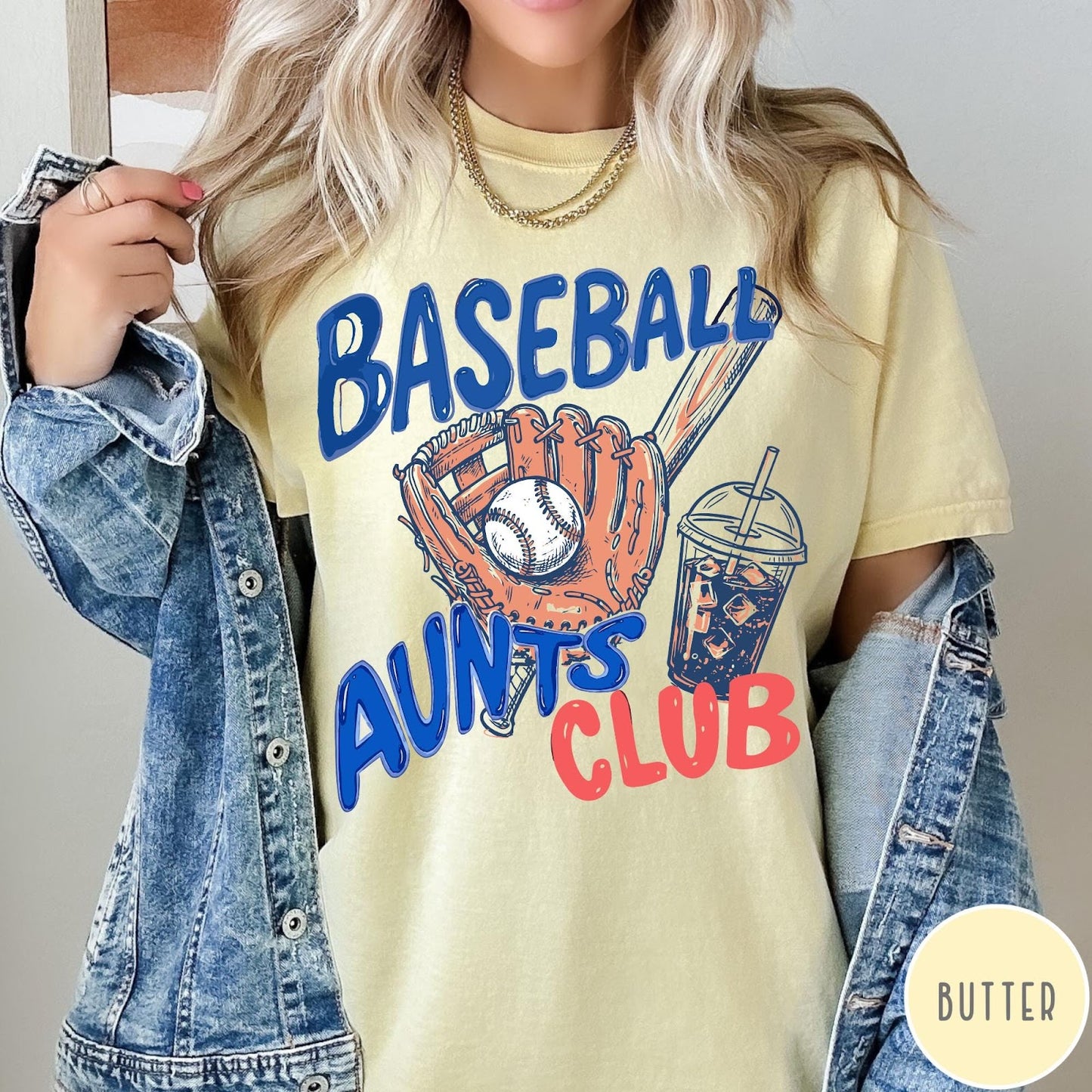 Comfort Colors tee in Butter featuring baseball graphic with a mitt, ball, bat, and iced coffee drink