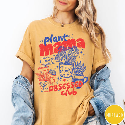 Comfort Colors tee in Mustard featuring graphic design with potted plants and Plant Mama Obsessed Club text