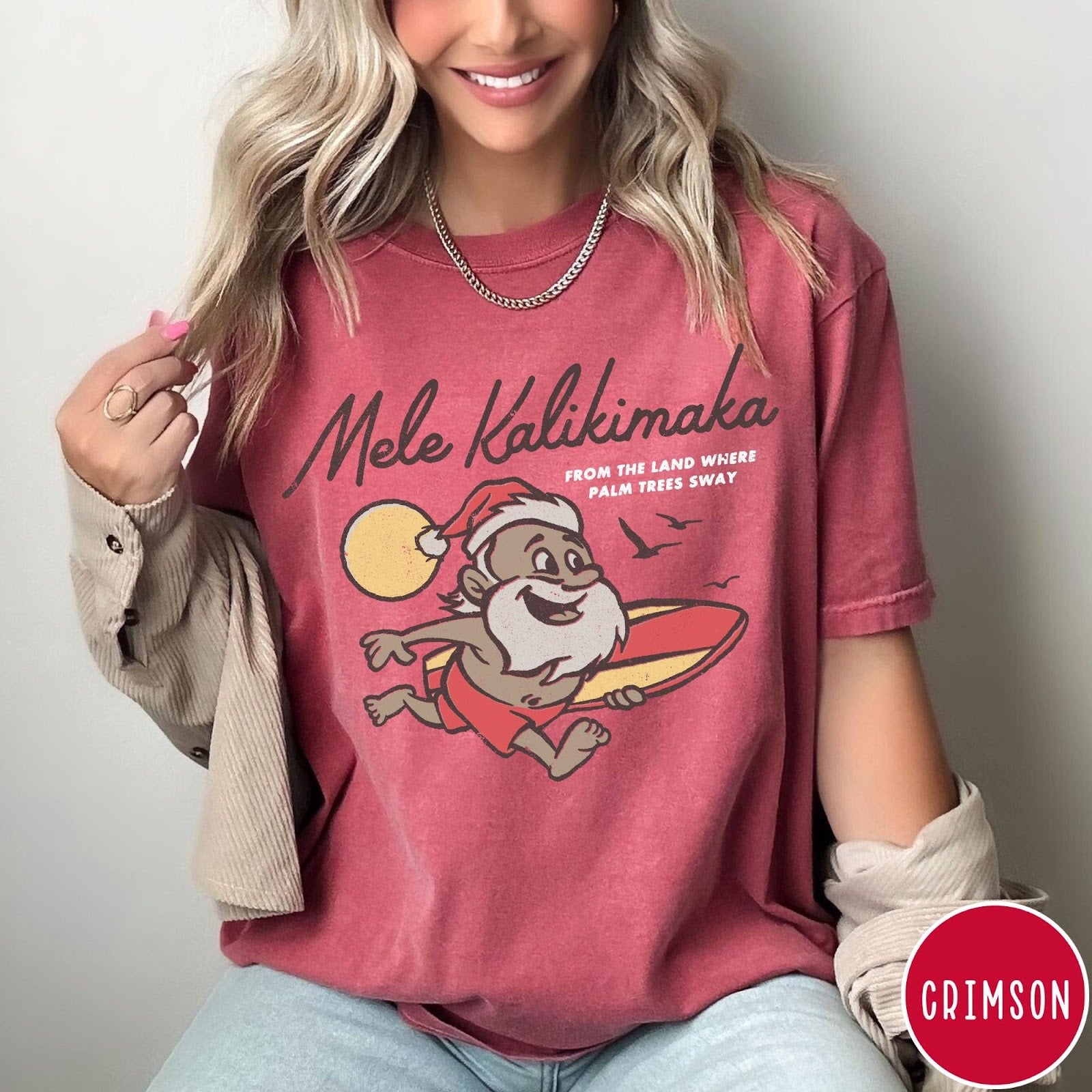 Comfort Colors tee in Crimson featuring vintage style graphic of a surfing Santa Claus on vacation