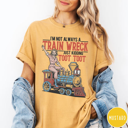 Comfort Colors tee in Mustard featuring vintage pin-up style graphic of a woman riding a steam train