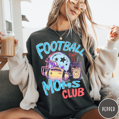 Comfort Colors tee in Pepper featuring football lifestyle graphic with helmet, football, and iced coffee drink design