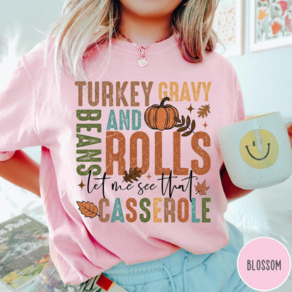 Comfort Colors tee in Blossom featuring vintage style Thanksgiving graphic with turkey, gravy, rolls, and casserole text