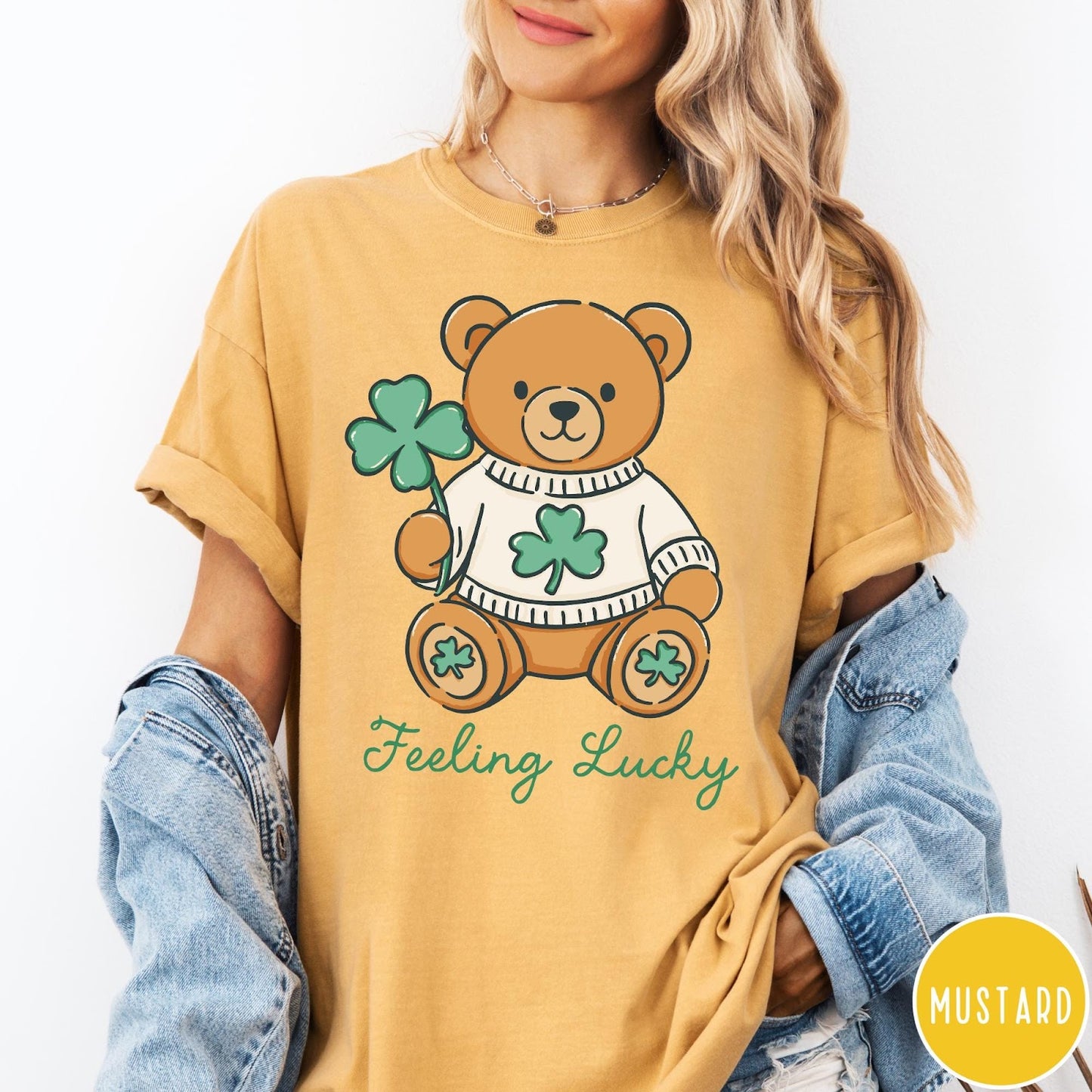 Comfort Colors tee in Mustard featuring cute teddy bear graphic wearing a sweater with shamrocks