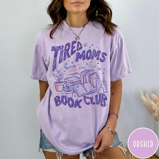 Comfort Colors tee in Orchid featuring book club graphic with plants, candles, and reading related text