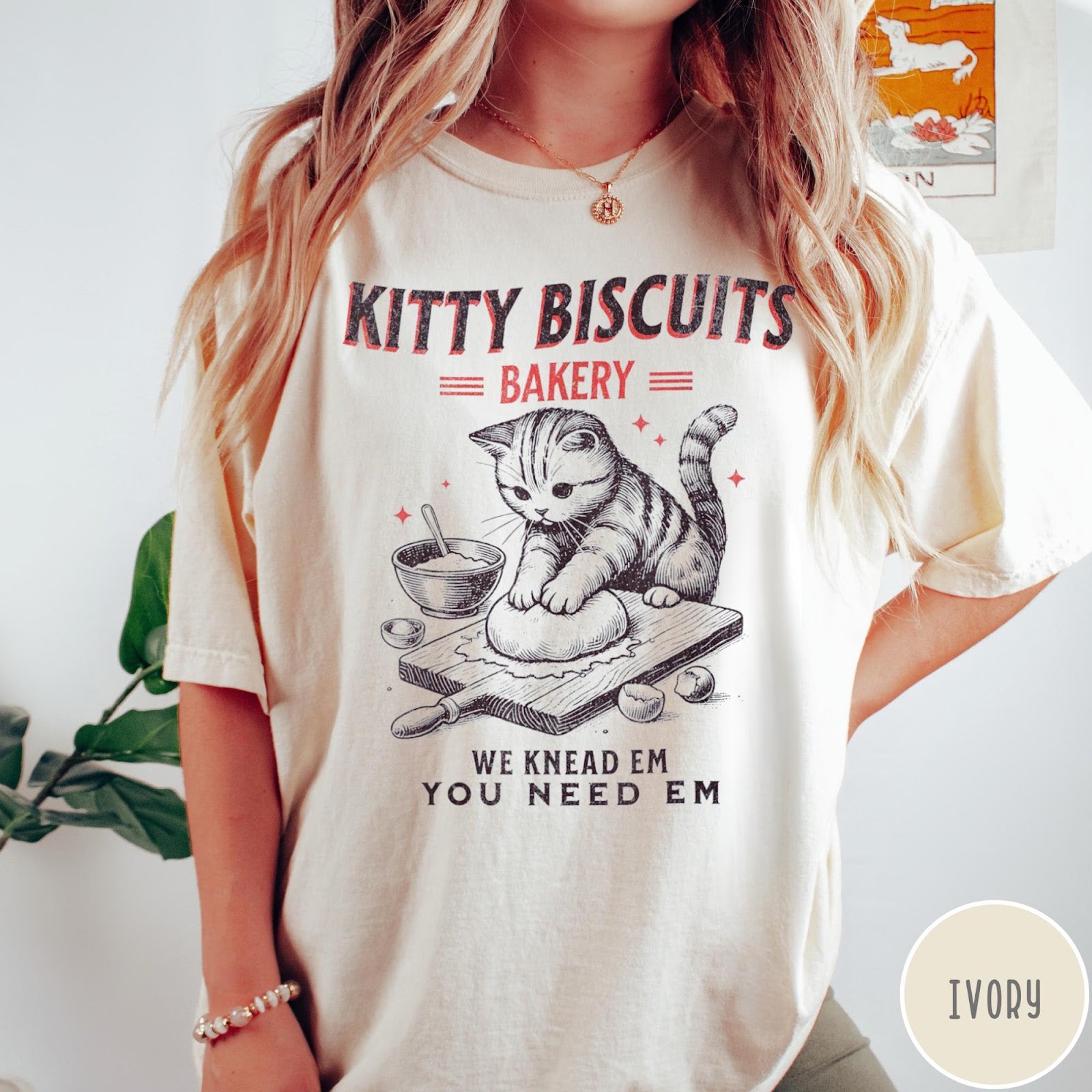 Comfort Colors tee in Ivory featuring vintage style graphic of a cute cat kneading dough for biscuits