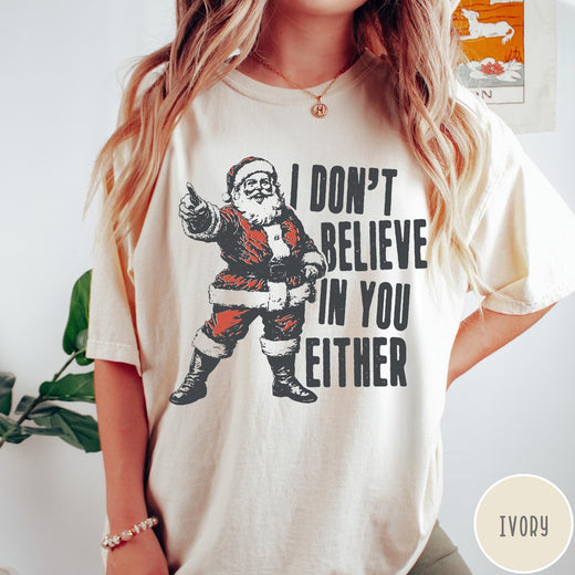 Comfort Colors tee in Ivory featuring vintage style Santa Claus graphic with text I Don't Believe In You