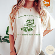 Comfort Colors tee in Ivory featuring vintage style graphic of a girl wrestling an alligator