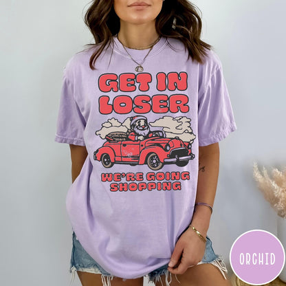 Comfort Colors tee in Orchid featuring retro style graphic of Santa Claus driving a red convertible car