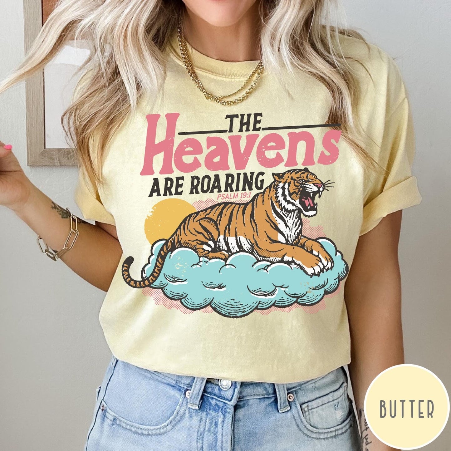 Comfort Colors tee in Butter featuring retro graphic design of a roaring tiger resting on a cloud