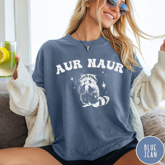 Comfort Colors tee in Blue Jean featuring retro style graphic of a raccoon with stars and text