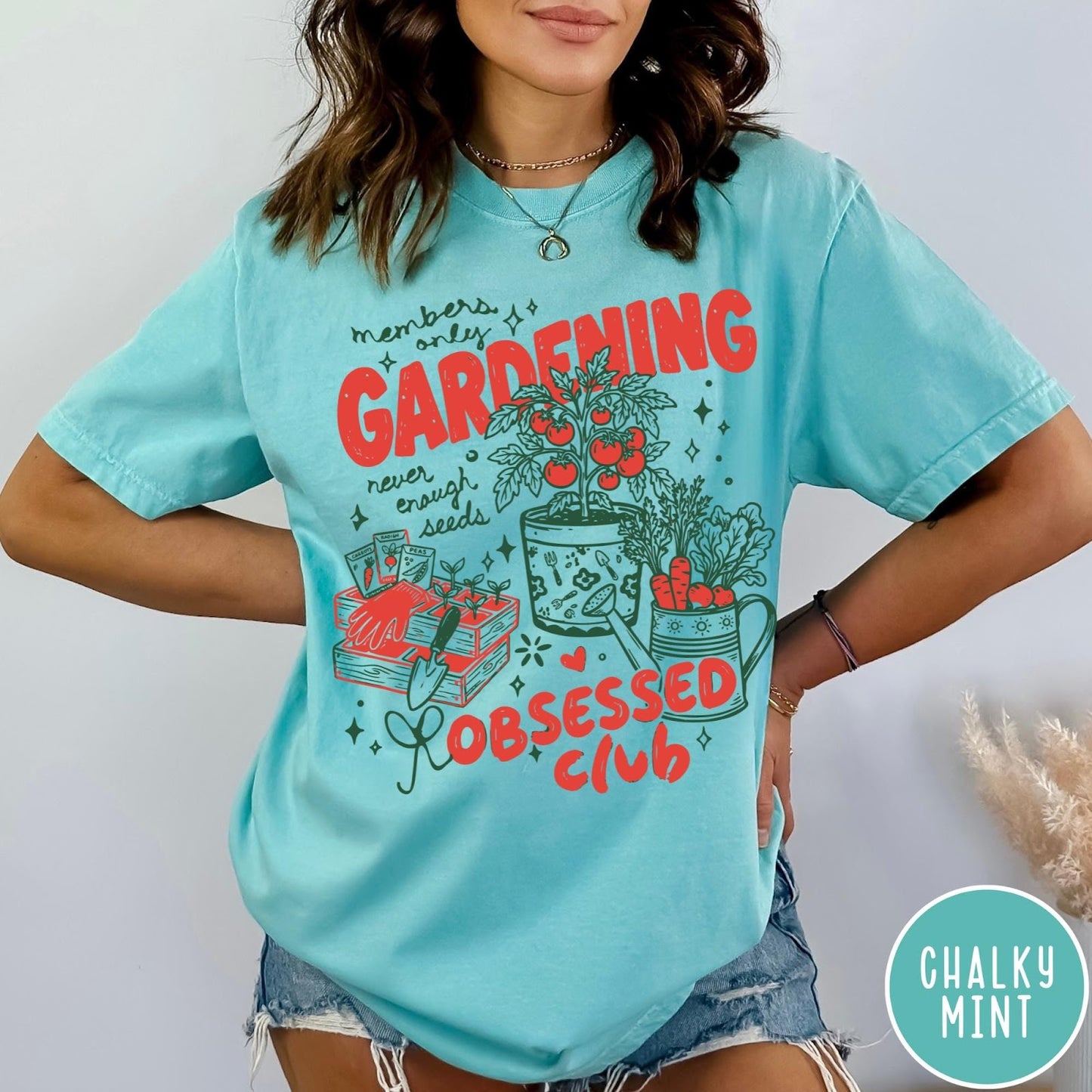 Comfort Colors tee in Chalky Mint featuring retro graphic gardening design with plants, tools, and seeds