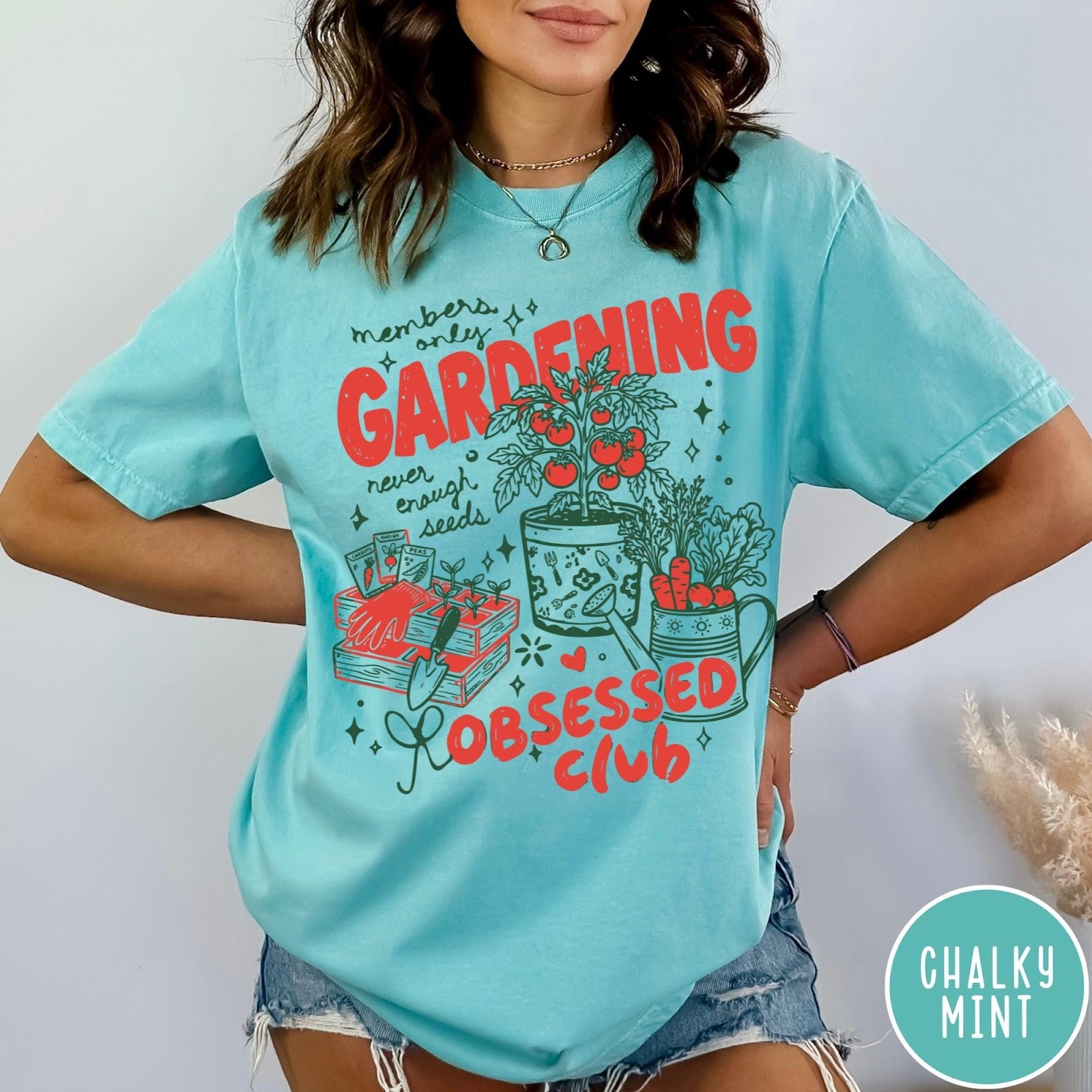 Comfort Colors tee in Chalky Mint featuring retro graphic gardening design with plants, tools, and seeds