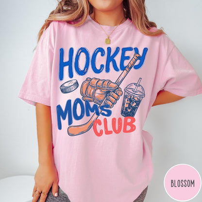 Comfort Colors tee in Blossom featuring hockey mom lifestyle graphic with hockey glove, puck, and drink