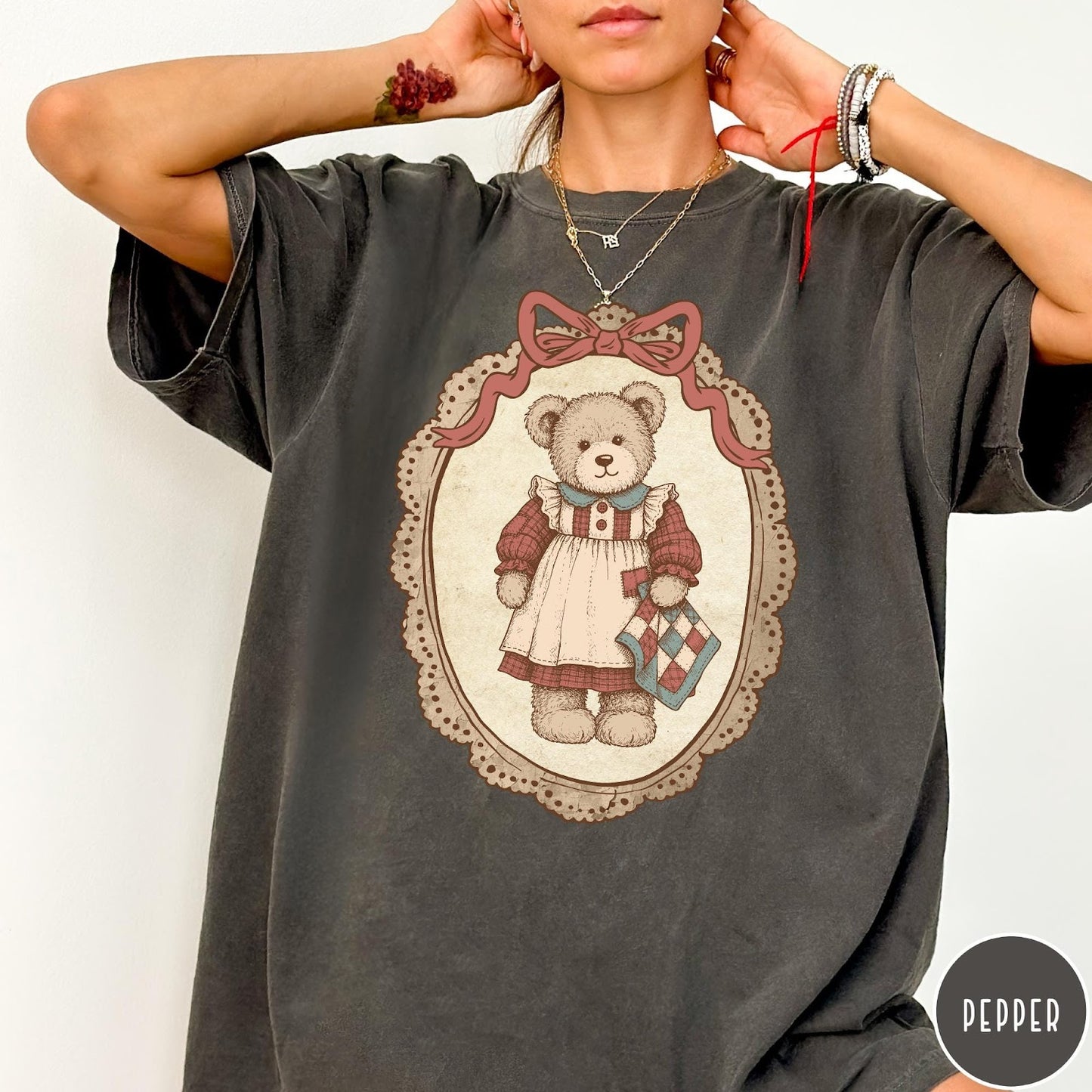 Comfort Colors tee in Pepper featuring vintage style teddy bear graphic inside a decorative lace oval frame