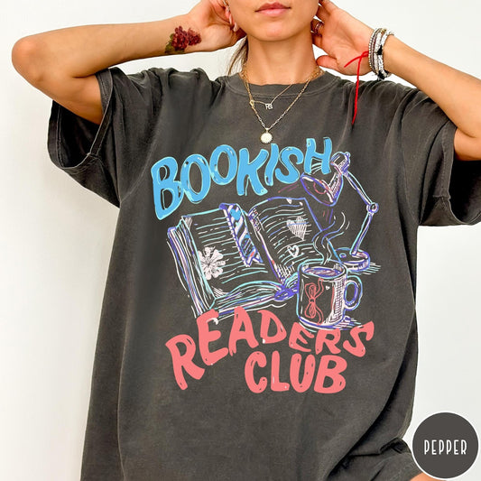 Comfort Colors tee in Pepper featuring illustrated book graphic with a lamp and a coffee mug design