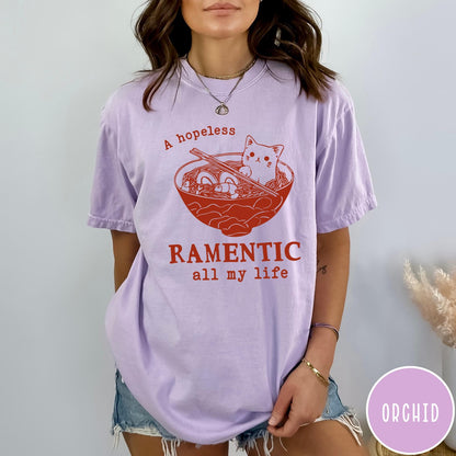 Comfort Colors tee in Orchid featuring line art graphic of a cute cat inside a ramen bowl