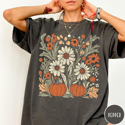 Comfort Colors tee in Pepper featuring boho floral design with pumpkins and daisies in fall colors