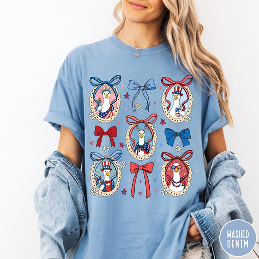Comfort Colors tee in Washed Denim featuring coquette style patriotic goose graphic with bows and floral accents