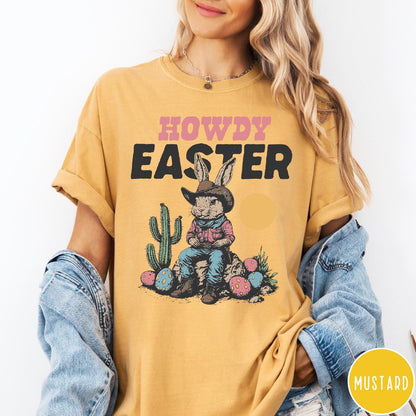 Comfort Colors tee in Mustard featuring western graphic of a cowboy bunny sitting with cactus and eggs