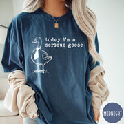 Comfort Colors tee in Midnight featuring minimalist graphic design of a goose wearing a necktie and text