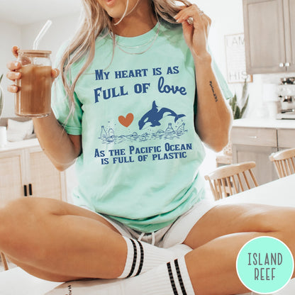 Comfort Colors tee in Island Reef featuring screen printed orca and plastic pollution graphic with ocean conservation text