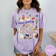 Comfort Colors tee in Orchid featuring vintage religious style graphic with Jesus, angels, lambs, and floral elements