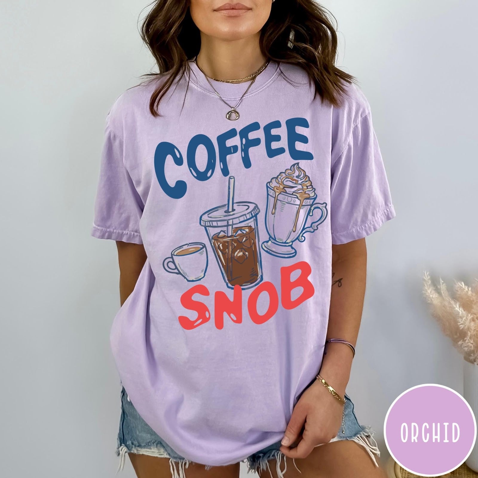 Comfort Colors tee in Orchid featuring illustrated coffee graphic with iced coffee, hot coffee, and whipped cream.