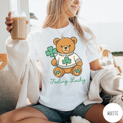 Comfort Colors tee in White featuring cute teddy bear graphic wearing a sweater with shamrocks