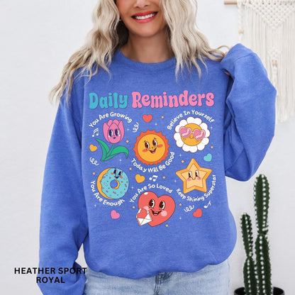 Comfort Colors tee in Heather Sport Royal featuring retro mascot design with daily affirmations and colorful graphics