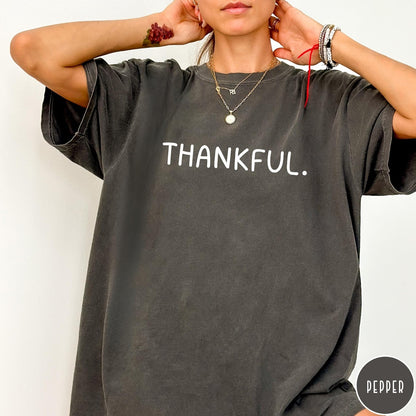 Comfort Colors tee in Pepper featuring minimalist style with the word Thankful printed in white text