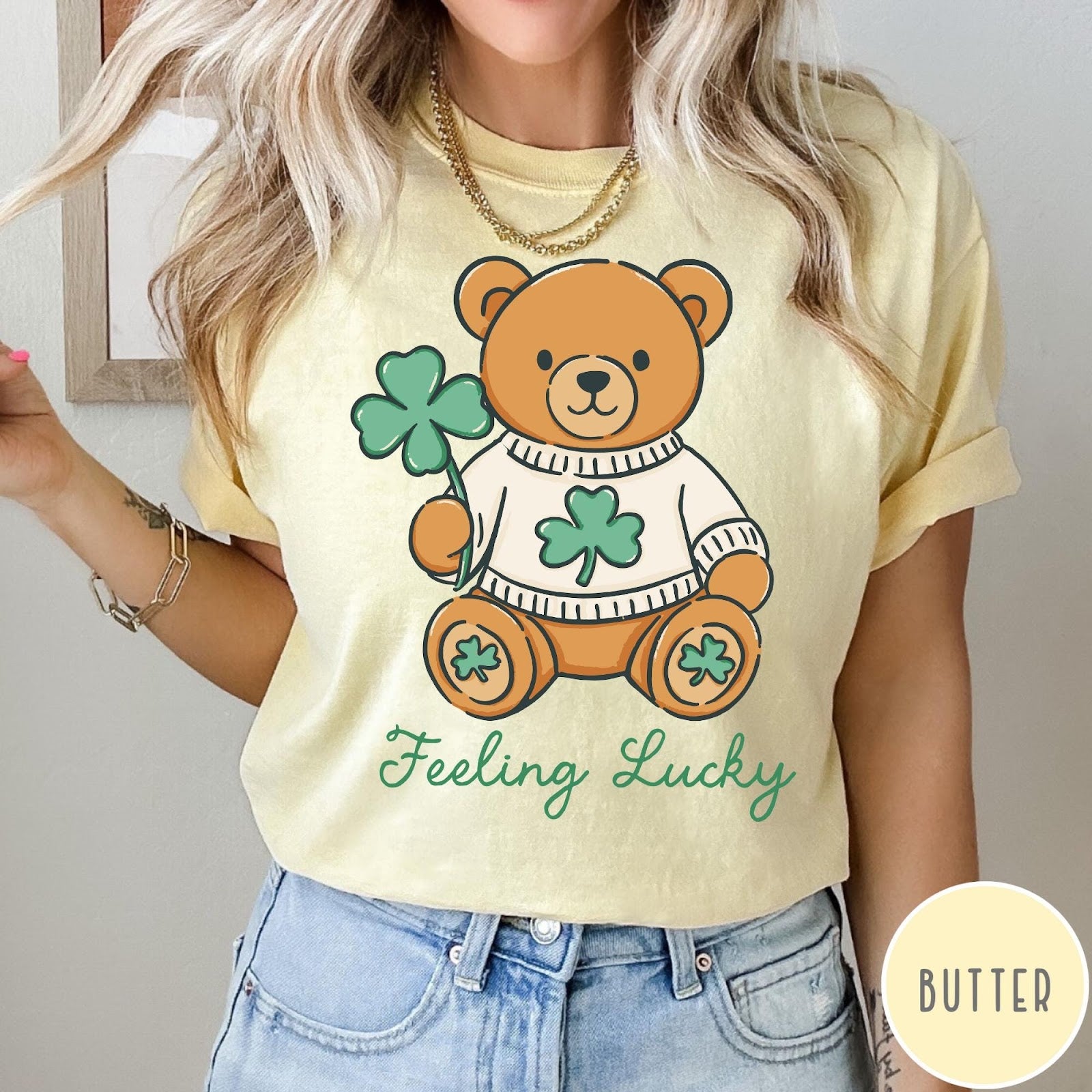 Comfort Colors tee in Butter featuring cute teddy bear graphic wearing a sweater with shamrocks