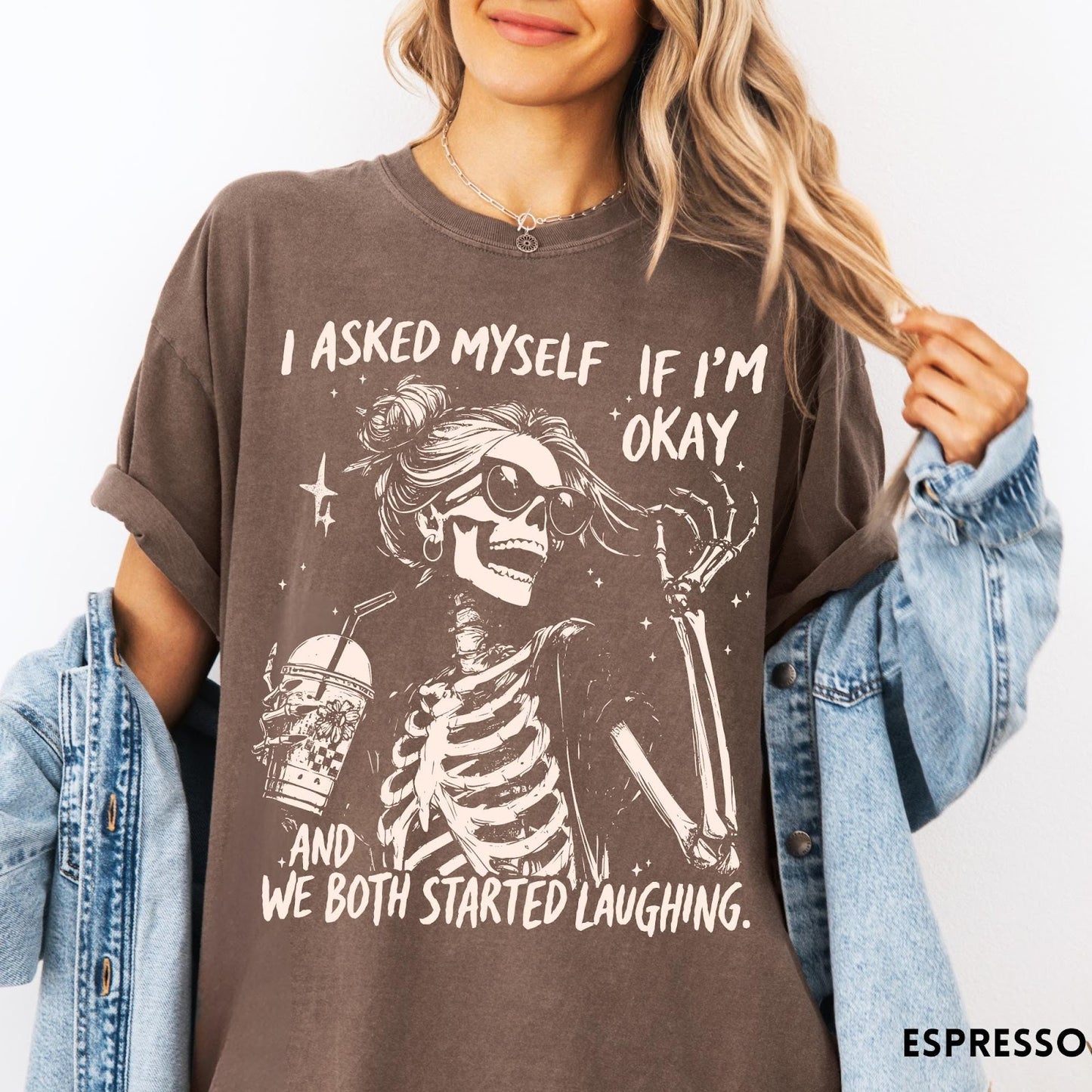 Comfort Colors tee in Espresso featuring skeleton design with sunglasses and iced coffee with laughing text graphic
