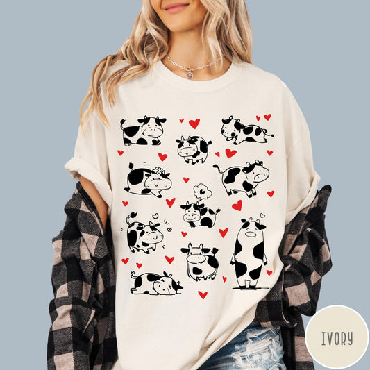 Comfort Colors tee in Ivory featuring cute cow lover graphic with various black and white cow illustrations