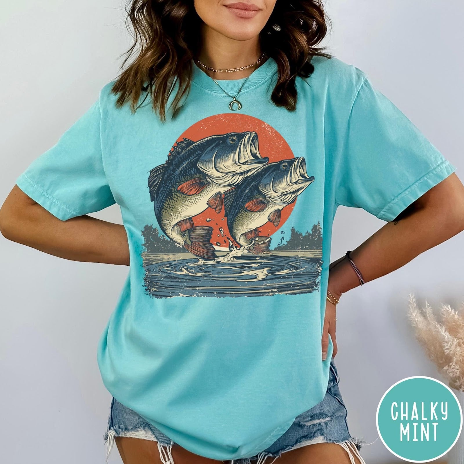 Comfort Colors tee in Chalky Mint featuring vintage style graphic of two bass fish jumping from water