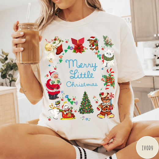Comfort Colors tee in Ivory featuring vintage style holiday characters including Santa, a snowman, and gingerbread man.