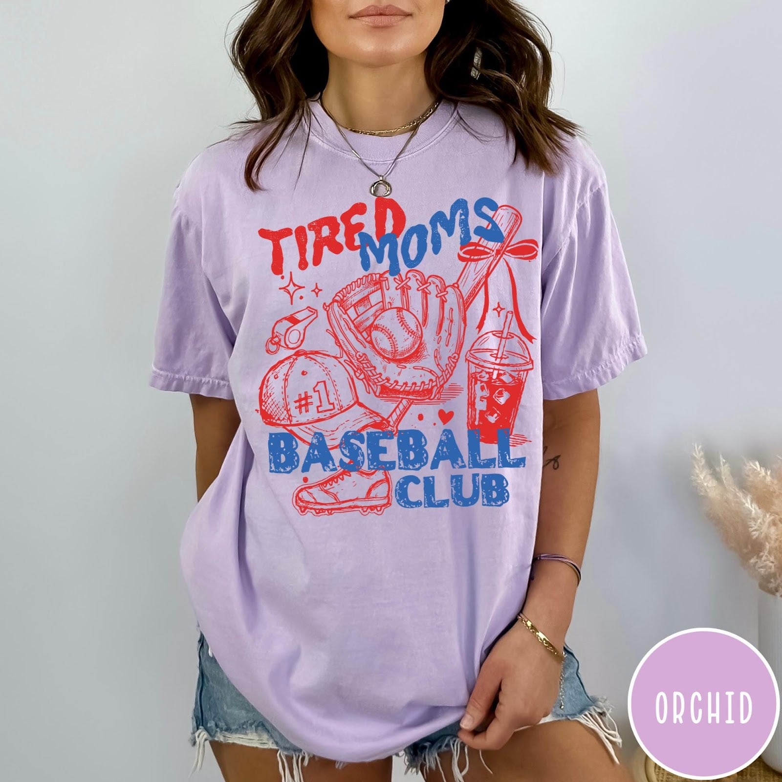 Comfort Colors tee in Orchid featuring baseball mom life graphic with glove, ball, cap, and iced coffee