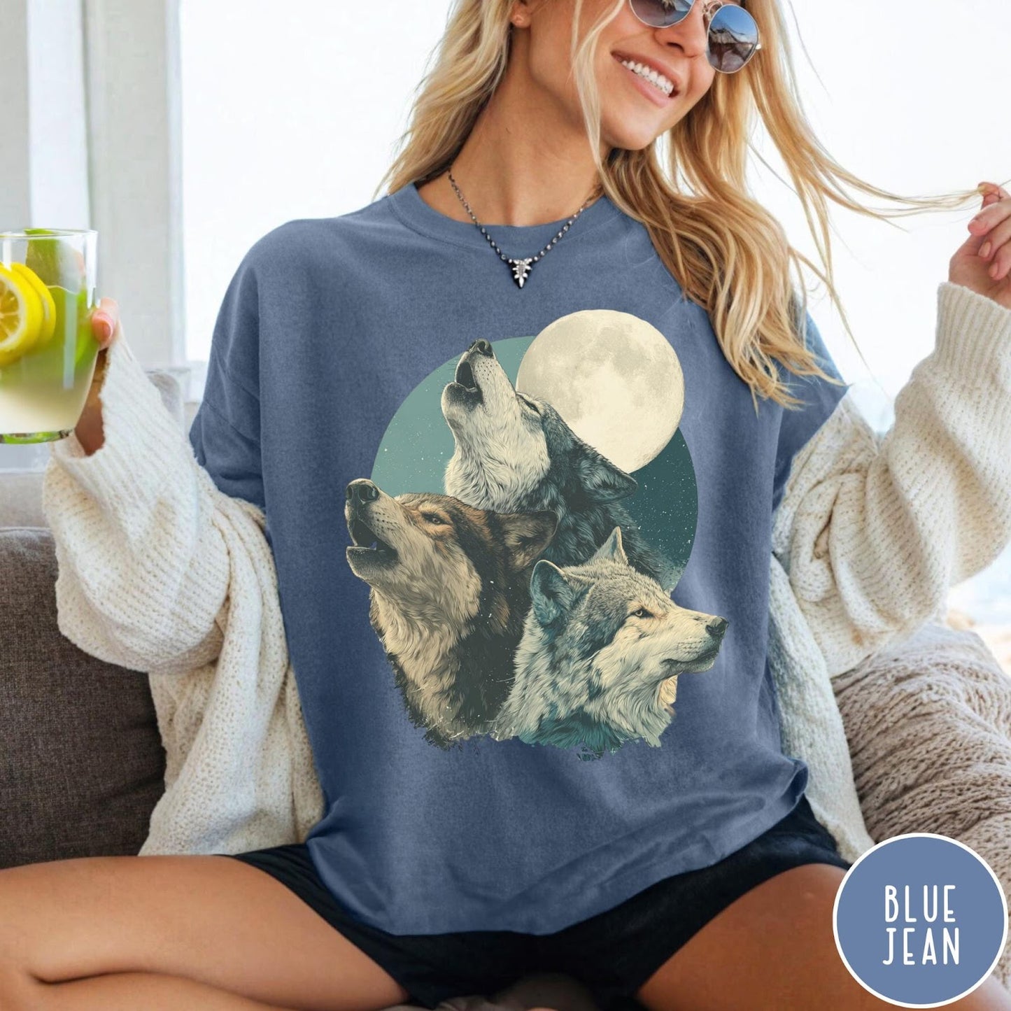 Comfort Colors tee in Blue Jean featuring vintage style graphic of three howling wolves under a full moon