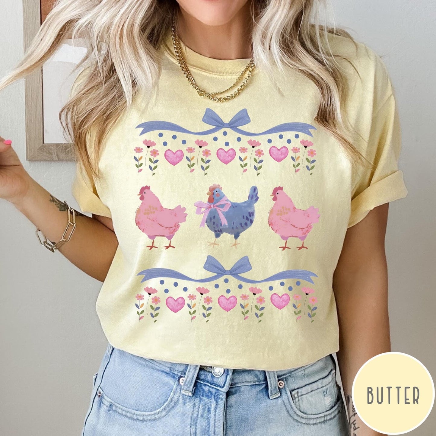 Comfort Colors tee in Butter featuring vintage style graphic with three chickens, floral accents, and blue bows