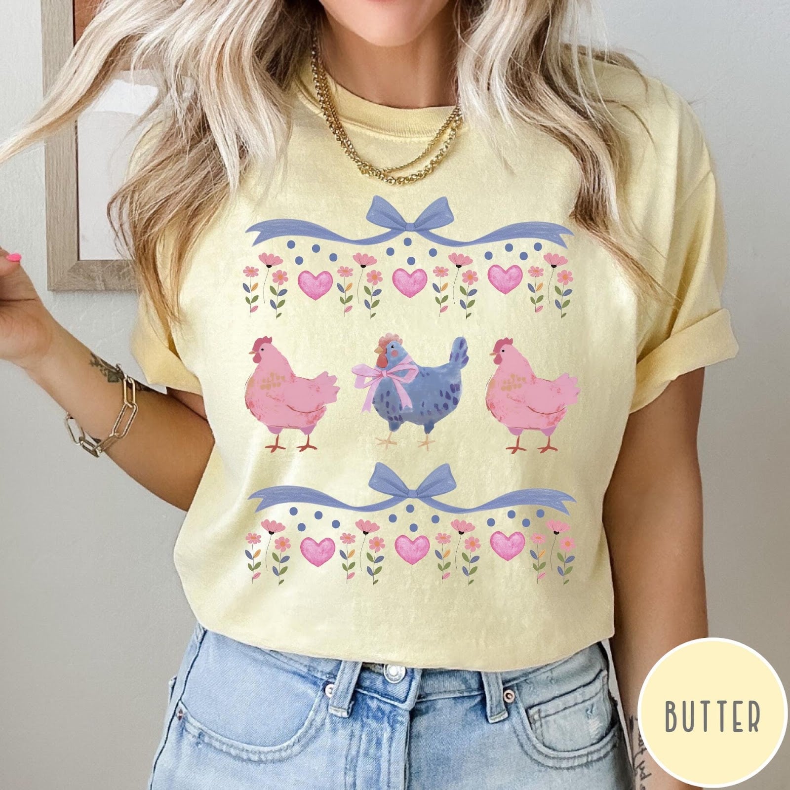 Comfort Colors tee in Butter featuring vintage style graphic with three chickens, floral accents, and blue bows